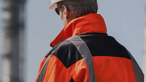 man-in-orange-jacket