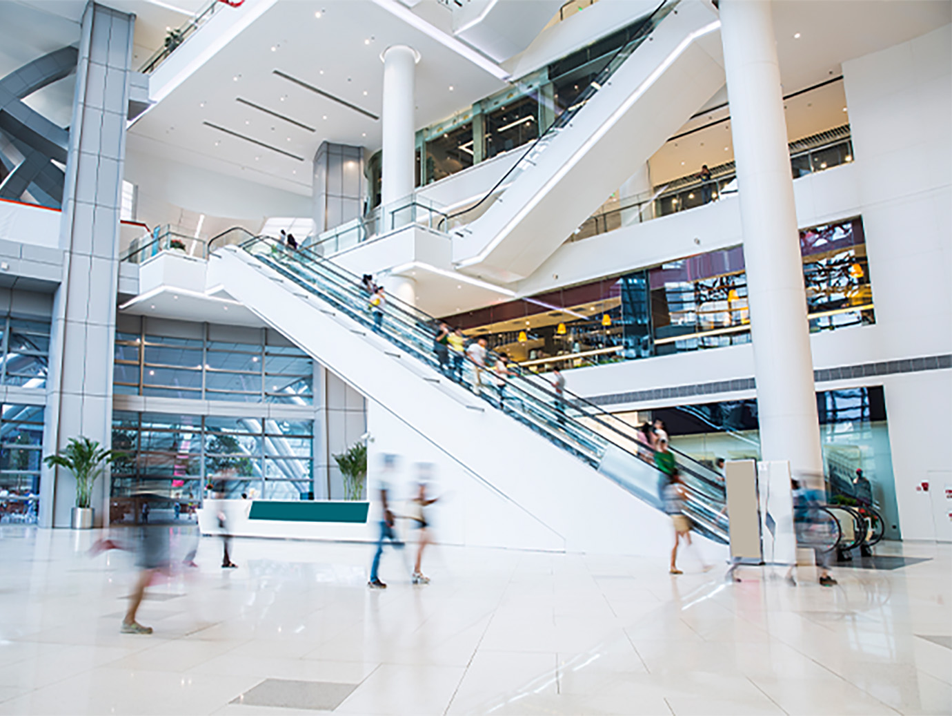 Motion-blur shot of a shopping mall with escalators