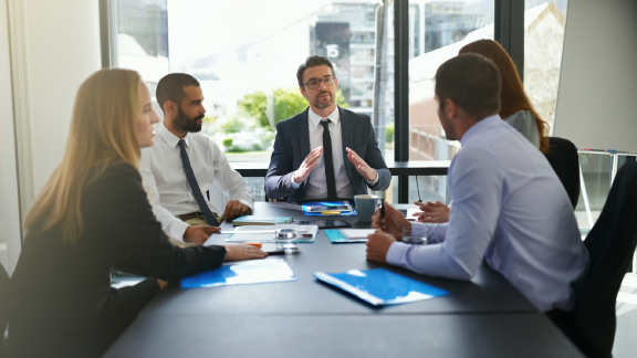 Five businesspeople- in a meeting