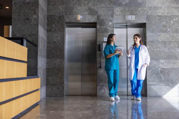 Doctor and nurse having discussion in lobby
