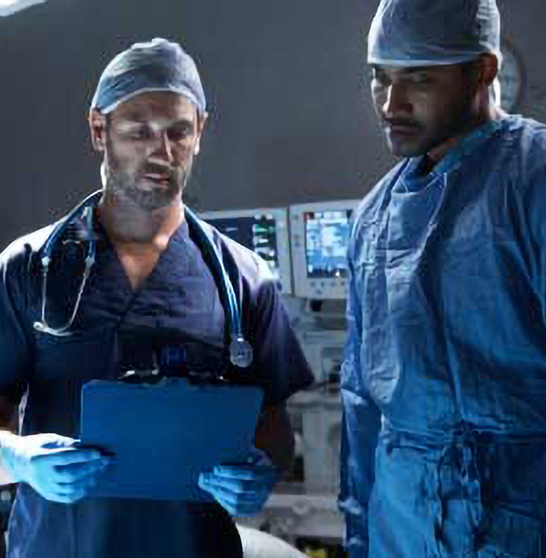 Two doctors discussing something in Hospital room