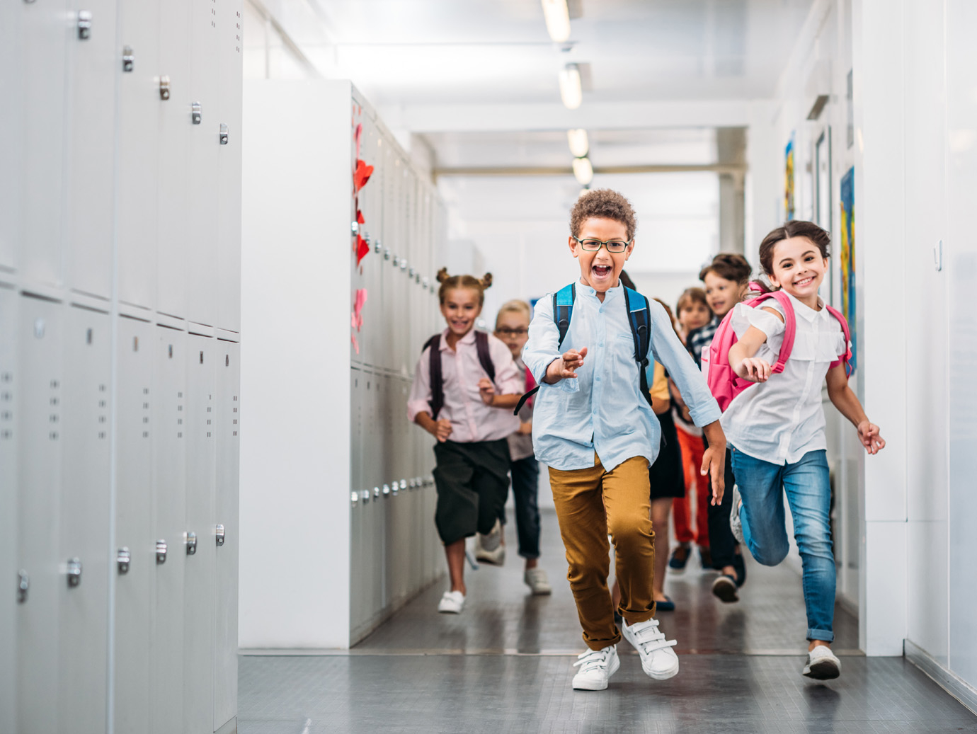 Children running in a school corridor