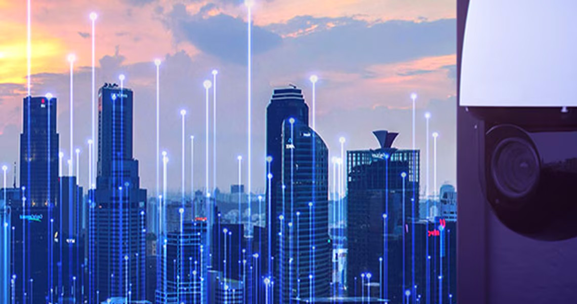 A video surveillance device installed, with skyscrapers in the background