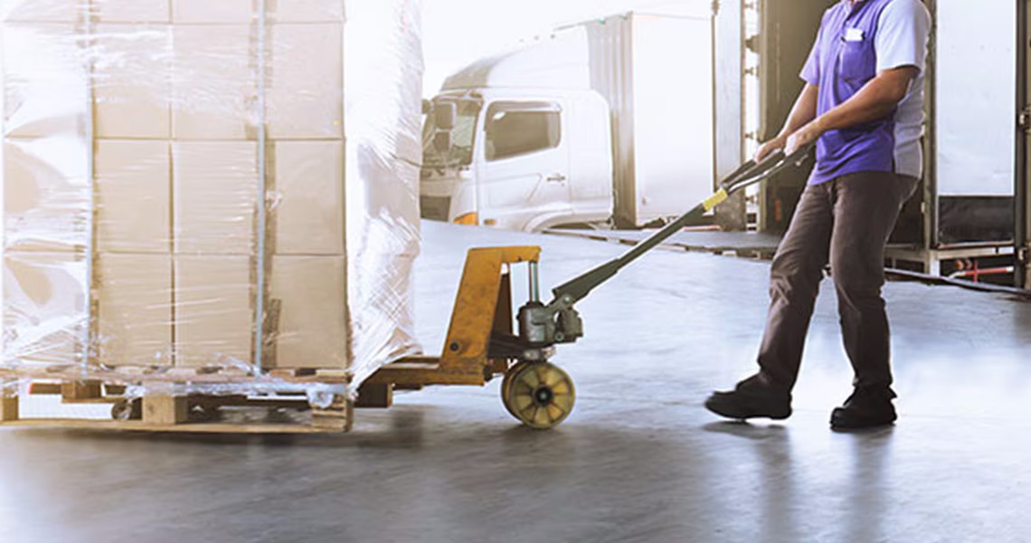 Man operating material handling equipment