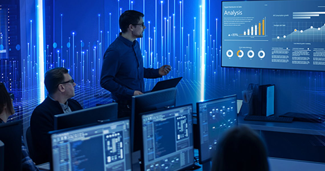 Man presenting analytical infographics to a group of people in a meeting room, with a graphic of transmission nodes overlaid on the background