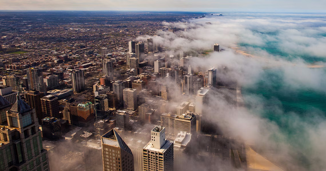 Aerial view Chicago's skyline, partially covered by clouds