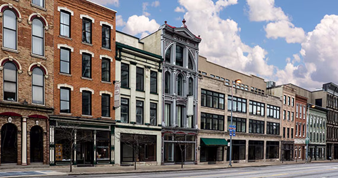 Empty street in front of old brick buildings