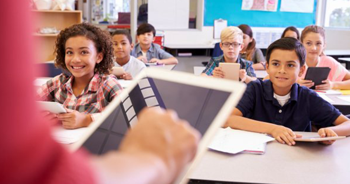 Elementary students sitting in a classroom