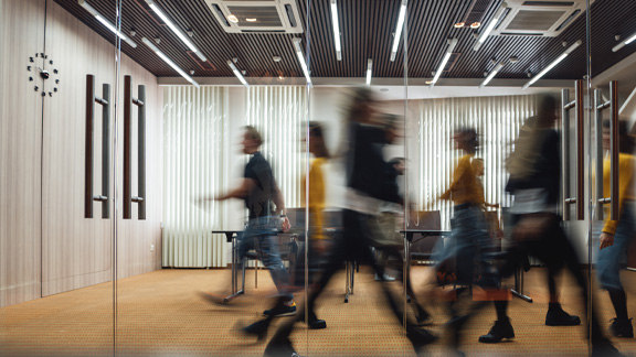 people walking through corridor