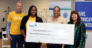 George Oliver distributing "Smart and Healthy Neighborhood" grants for Milwaukee-area nonprofit organizations