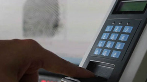 A man giving his fingerprint impression for biometrics access control