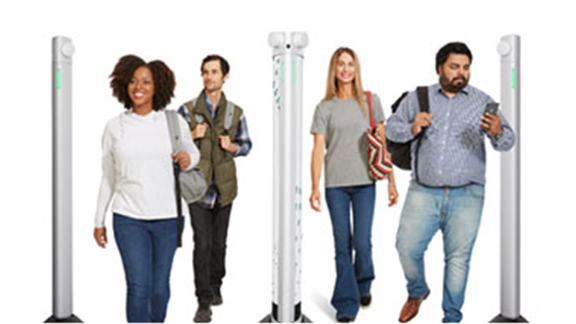 Staff walking through weapon detection entrance