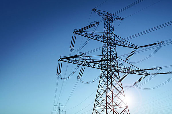 An electricity tower against the sky during the day
