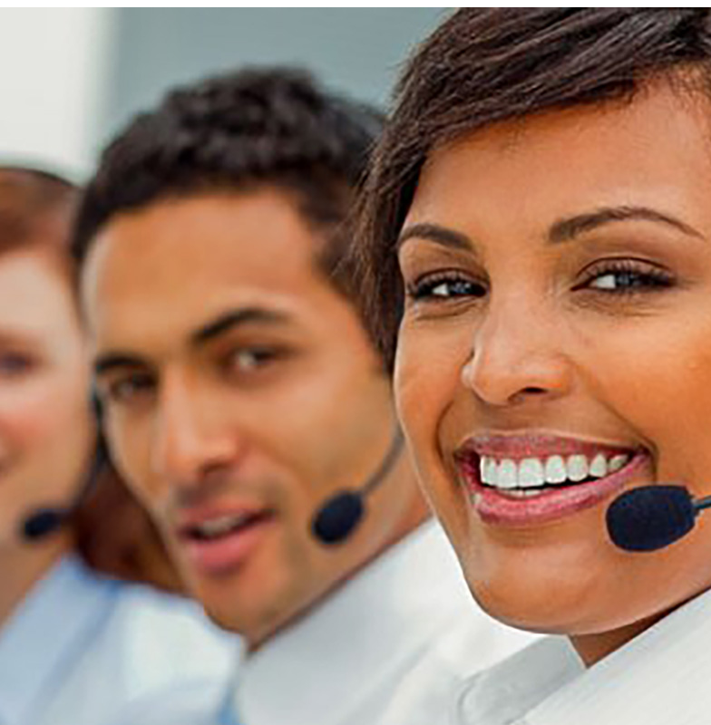 People wearing headphones with microphones looking into the camera