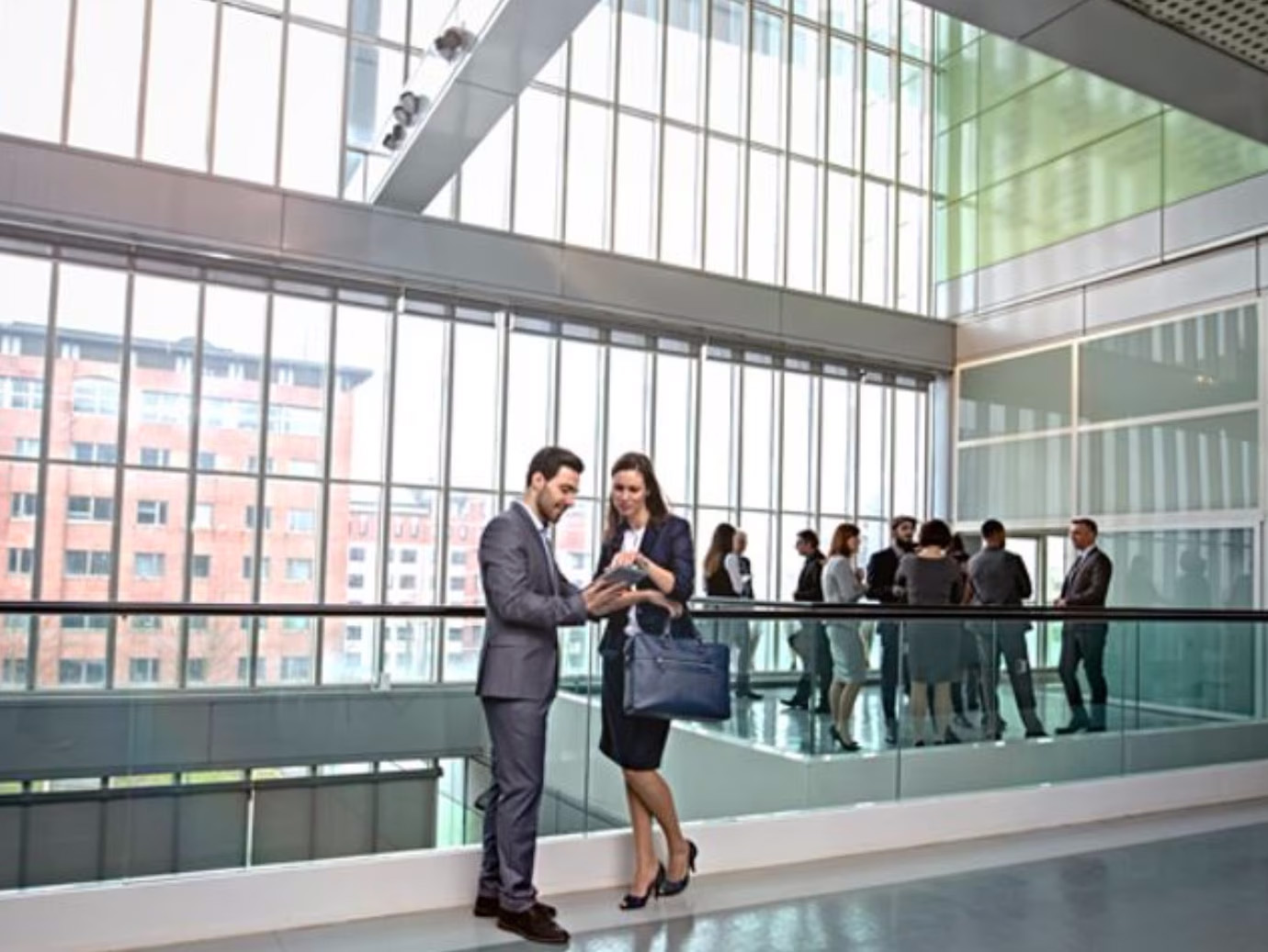 Diverse group of employees conversing in the lobby of an office