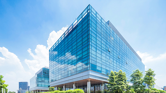 A glass commercial building at daytime